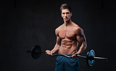 Fototapeta na wymiar Athletic shirtless male biceps barbell workout. 