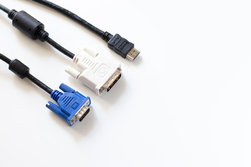Monitor cables, HDMI, DVI and VGA isolated on white background. Top view with copy space.