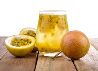 Passion fruit and passion fruit juice isolated on white background.
