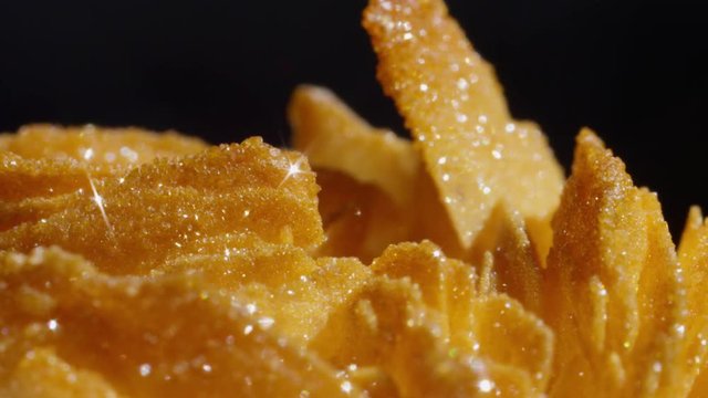 Macro DOF charming golden barite vanadinite stone with rough surface glittering