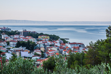 Naklejka premium Aerial view on Adriatic Sea and Baska Voda place in Makarska Riviera, Dalmatia region, Croatia.