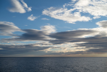 Naklejka na ściany i meble Clouds over the sea
