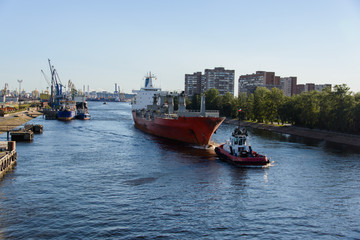 Towing of cargo vessel in port