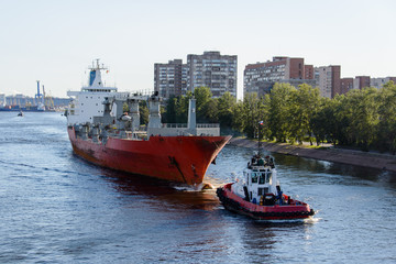 Towing of cargo vessel in port