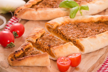 Fototapeta na wymiar Turkish pide pizza with meat and onion. 