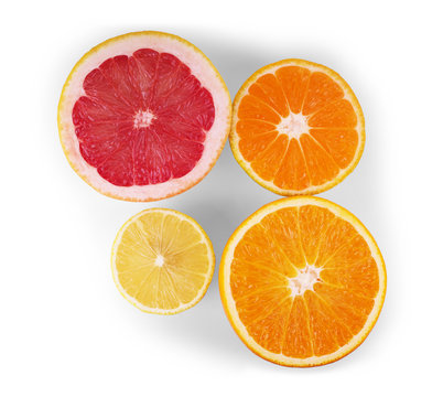 Isolated citrus fruits wedges. Falling pieces of orange, lemon, lime and grapefruit isolated on white background with clipping path