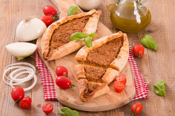 Turkish pide pizza with meat and onion. 