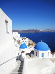Fototapeta na wymiar Beautiful scenery of blue dome church at Santorini Island, Greece