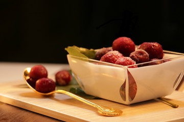 frozen cherries desert on the table and black background