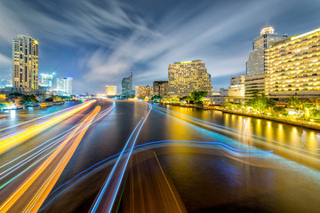 Fototapeta na wymiar Light trails of traffic on the Chao Phraya river, Bangkok. Thailand. view from Taksin bridge Bangkok
