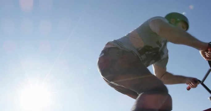 BMX a no hander in sunshine - extreme close up
