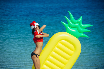 Santa claus sexy girl in red Christmas costume.