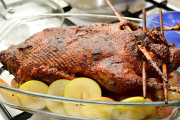 Grilling Christmas turkey with crispy crust in the oven and stuffing it with apples