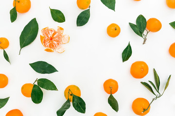 Round frame of citrus and leaves on white background. Flat lay. Top view