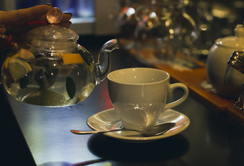 Herbal tea and Cup on the bar counter in cafe