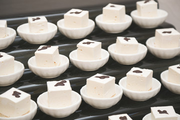 Sweets in the cafe. Portion marshmallow in plates