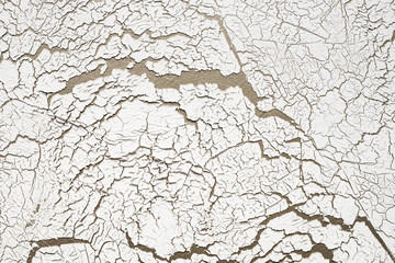 Background of white wall with cracked texture.