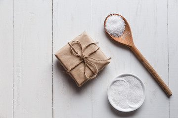 Healthy Sea Salt with giftbox on white wooden background
