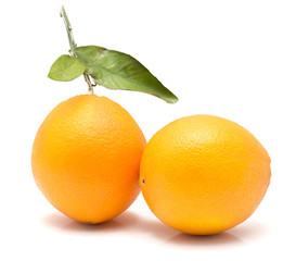 Two fresh oranges with green leaf isolated on white background.