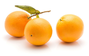 Oranges with green leaf isolated on white background three whole.