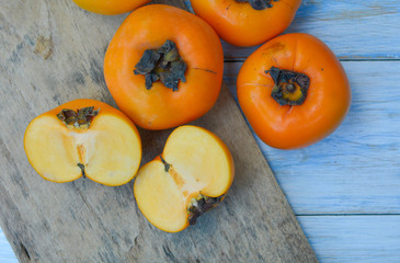 Persimmon on blue background