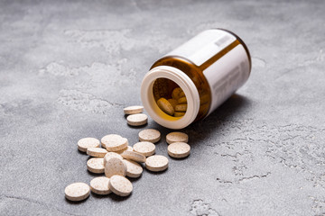 Medical tablet on grey background