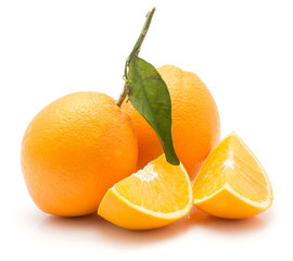 Oranges isolated on white background two whole with green leaf two sliced quarters.