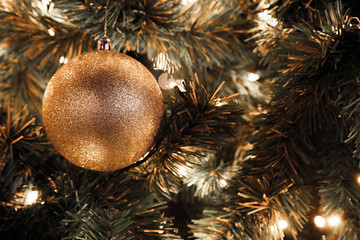 Golden Christmas ball in Christmas tree