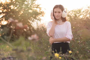 Portrati of beautiful asian model  outdoors in a forest. Pretty Thai girl in garden. Free from copy space.