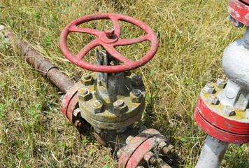 Manual shut-off valve on oil well. Oil well wellhead equipment.