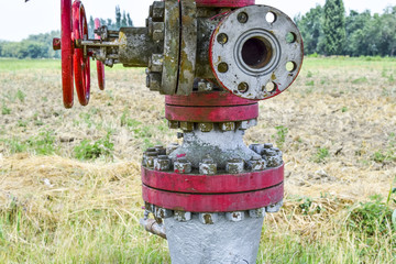 Manual shut-off valve on oil well. Oil well wellhead equipment.