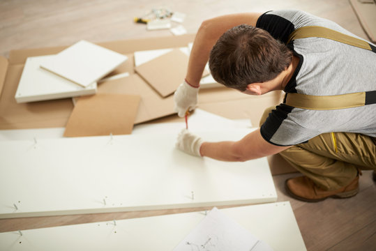 Man Assembling Furniture