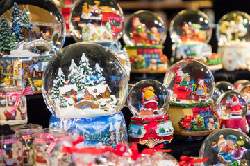 Various Christmas snow globes at a Christmas market in Berlin, Germany.
