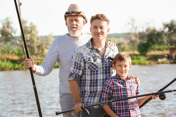 Family fishing on pond together