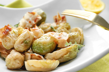 Plate with roasted Brussel sprouts and bacon, closeup