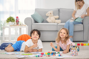 Little children painting at home