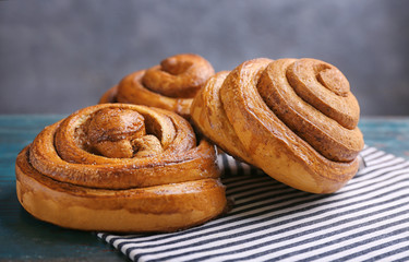 Sweet cinnamon rolls on table
