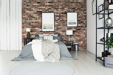 Simple bedroom with brick wall
