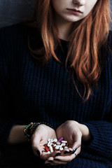 Teenager's hands with drugs