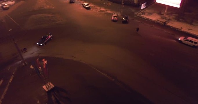 Illegal drift in the city. Car turns on circular road. Aerial top view