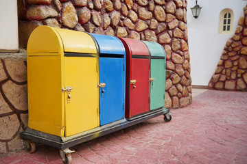 Different colorful trash bins outdoors. Recycling concept