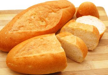 The cut bread on a chopping board.