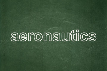 Science concept: text Aeronautics on Green chalkboard background