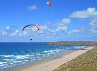 Paragliders above Perranporth Beach
