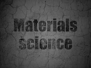 Science concept: Black Materials Science on grunge textured concrete wall background