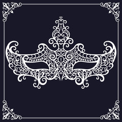 White lace masquerade mask on a black background
