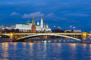The Moscow Kremlin with night lights on during the evening sunset in the fall