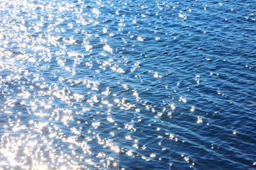 Sparkles on a Black Sea abstract background