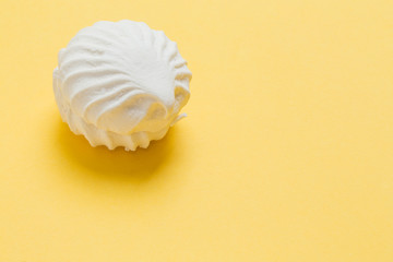 White marshmallows on a colored background