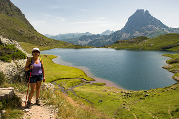 woman hiking near a mountain lake